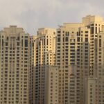 A close-up view of modern high-rise buildings in Dubai Marina, showcasing architectural detail and luxury living.